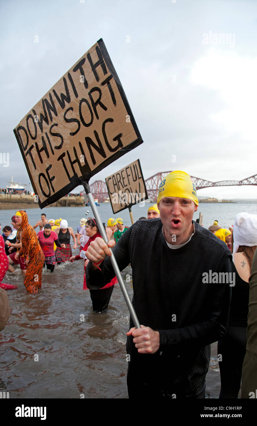 South Queensferry, UK. 1st Jan, 2012. 'Loony Dook' annual splash for charity in River Forth, Scotland, UK Stock Photo