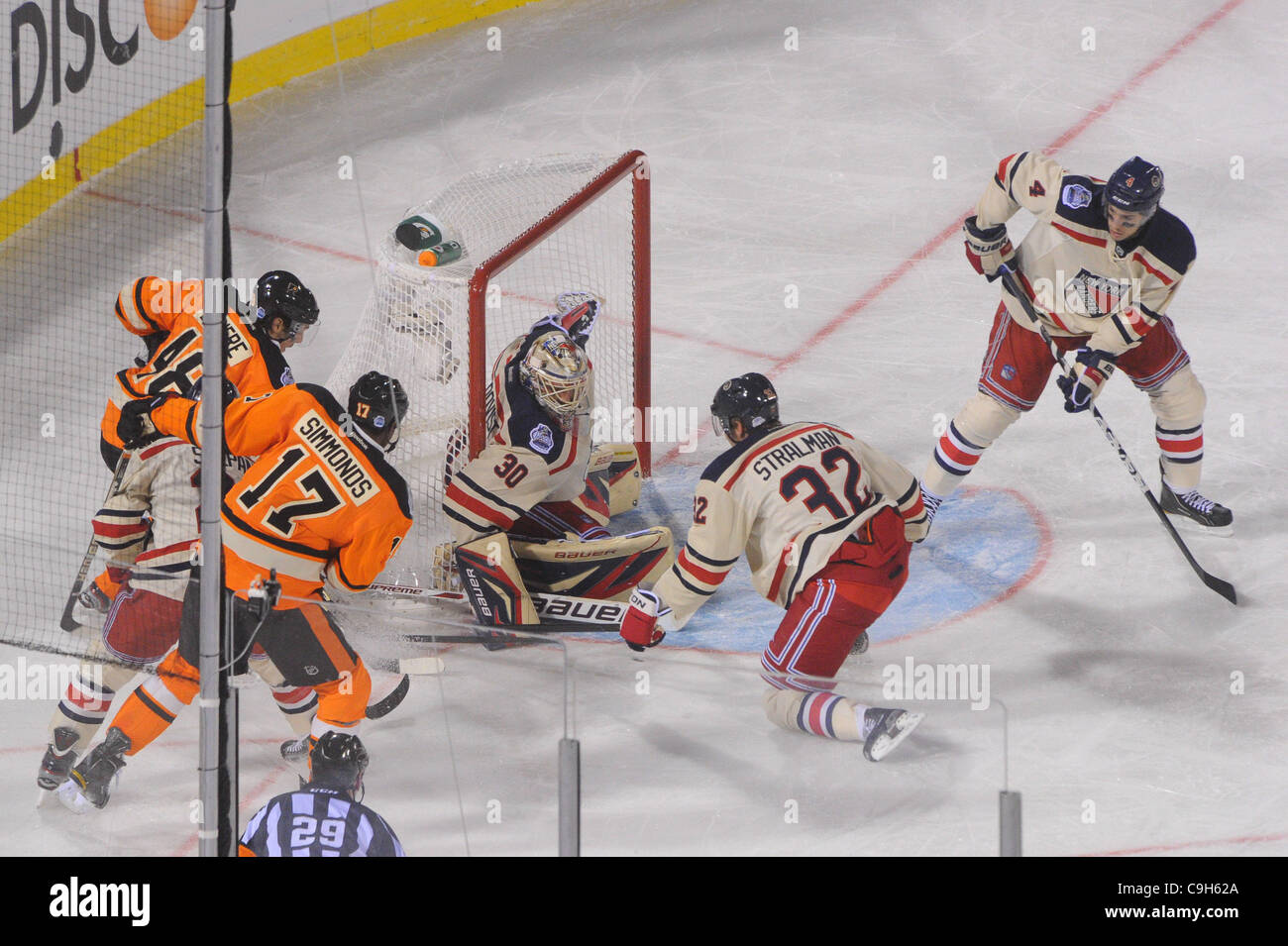 Jan. 02, 2012 - Philadelphia, Pennsylvania, U.S - New York Rangers goalie Henrik Lundqvist (30) and defenseman Anton Stralman (32) keep the puck out of the net against Philadelphia Flyers right wing Wayne Simmonds (17) during third period NHL Winter Classic action between the New York Rangers and Ph Stock Photo