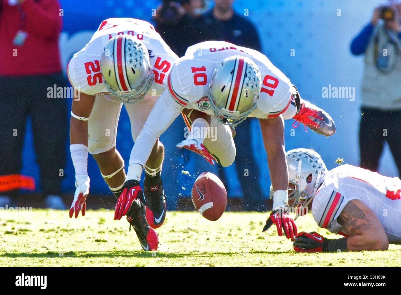 Jan. 2, 2012 - Jacksonville, Florida, U.S - Ohio State Buckeyes defensive back Bradley Roby (25) and Ohio State Buckeyes linebacker Ryan Shazier (10) go after a fumble in the first quarter of the game between Ohio State and Florida in the Gator Bowl at Everbank Field, Jacksonville, Florida. Florida  Stock Photo