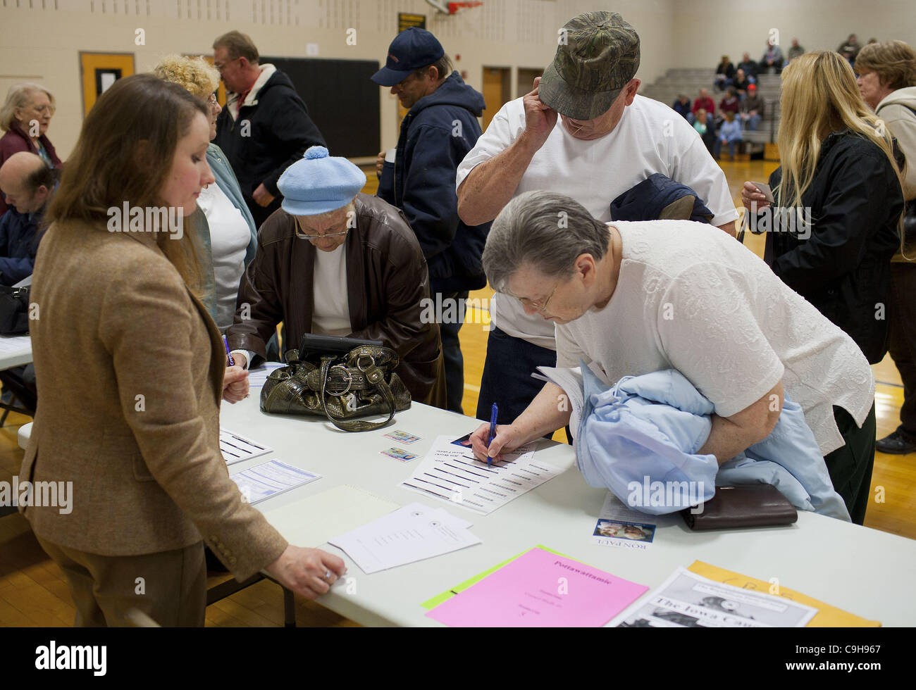 Jan. 4, 2012 - Council Bluffs, IA, USA - Mary Cronk (holding blue ...