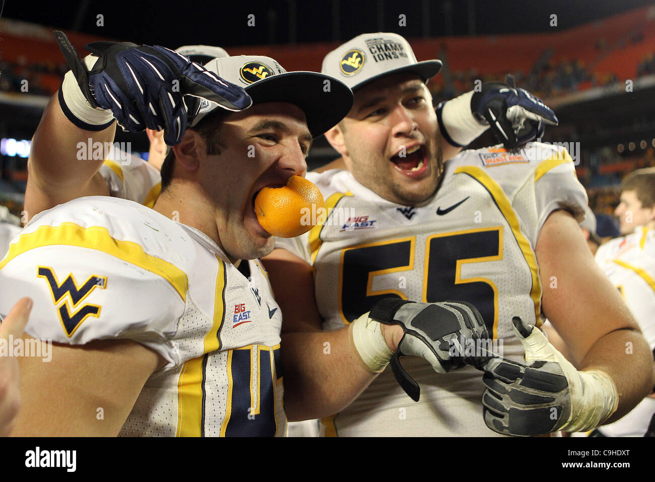 Jan. 5, 2012 - Miami Gardens, Florida, U.S - West Virginia Mountaineers  DOUG RIGG (47) &  TYLER RADER (55) celebrate there  70-33 win over Clemson during the 2012 Orange Bowl. (Credit Image: © Don Montague/Southcreek/ZUMAPRESS.com) Stock Photo