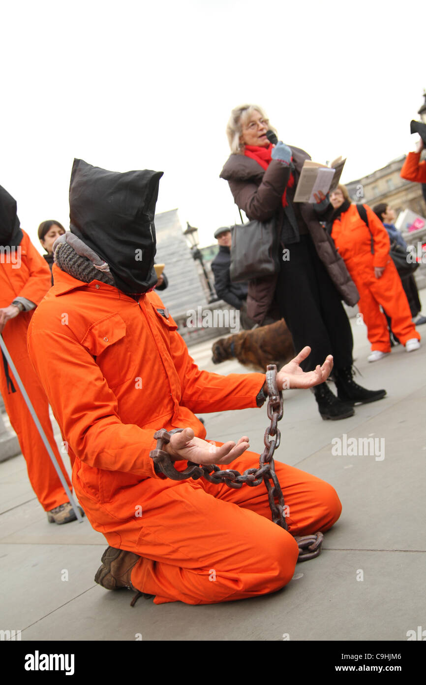 A man in Guantanamo Bay prisoner overalls seen as Victoria Brittain speaks at the 10th anniversary rally Stock Photo