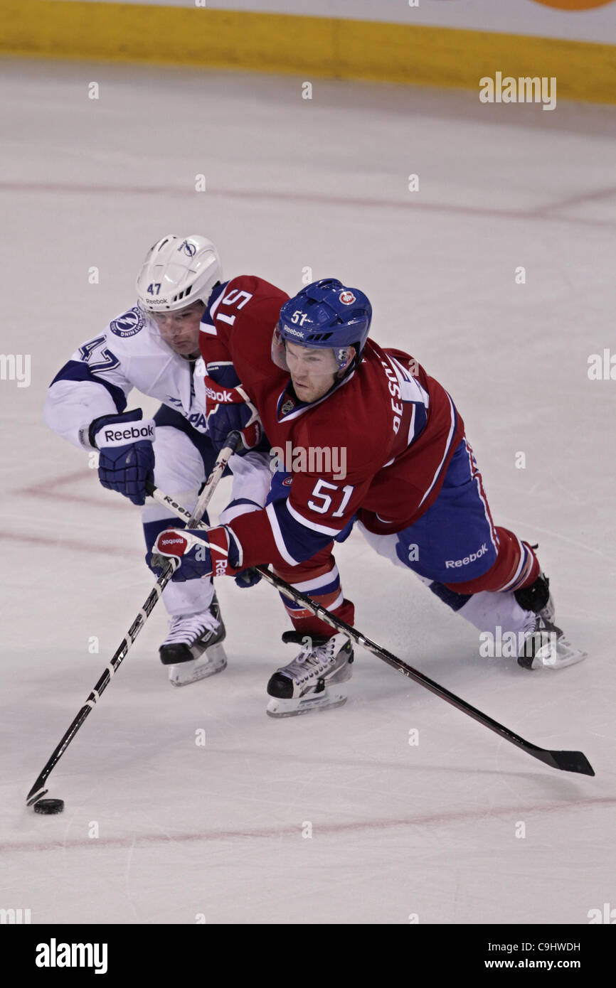 Jan. 7, 2012 - Montreal, Quebec, Canada - Tampa Bay Lightning defenceman Marc-Andre Bergeron (47) and Montreal Canadiens forward David Desharnais (51) battle for the puck in second period action during the Montreal Canadiens' game against the Tampa Bay Lightning at Bell Center. After two periods Mon Stock Photo
