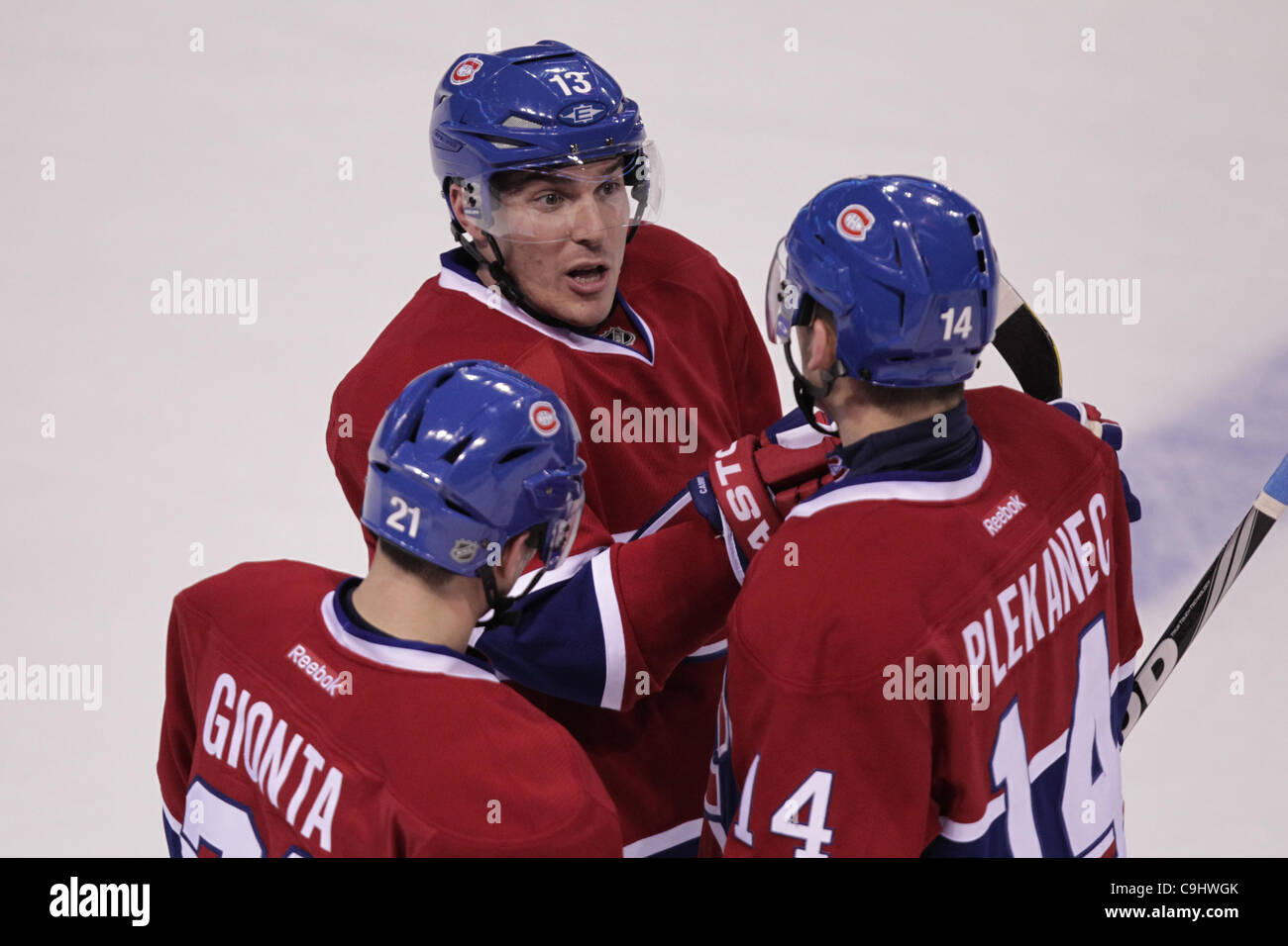 Jan. 7, 2012 - Montreal, Quebec, Canada - Montreal Canadiens forward Michael Cammalleri(13) discusses with Montreal Canadiens forward Tomas Plekanec (14) and Montreal Canadiens forward Brian Gionta (21) in first period action during the Montreal Canadiens' game against the Tampa Bay Lightning at Bel Stock Photo