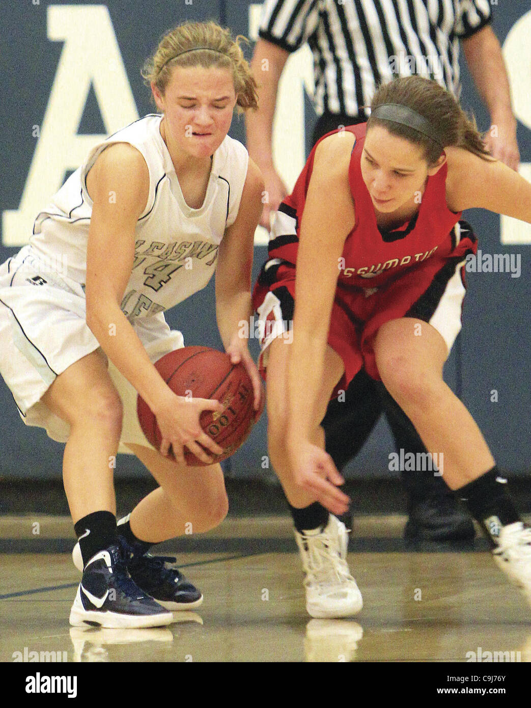 Jan. 6, 2012 - Bettendorf, Iowa, U.S. - Pleasant Valley's Maddie Reynolds and Davenport Assumption's Morgan Pavlich go for the loose ball, Friday, January 6, 2012, during first half action. (Credit Image: © John Schultz/Quad-City Times/ZUMAPRESS.com) Stock Photo