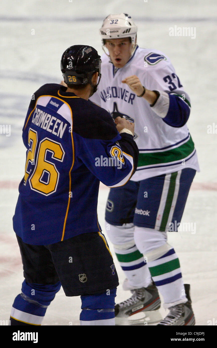 Jan. 12, 2012 - Saint Louis, Missouri, U.S - St. Louis Blues right wing B.J. Crombeen (26) and Vancouver Canucks right wing Dale Weise (32) fight during a NHL game between the Vancouver Canucks and the St. Louis Blues at the Scottrade Center in Saint Louis, Missouri. The Canucks defeated the Blues 3 Stock Photo