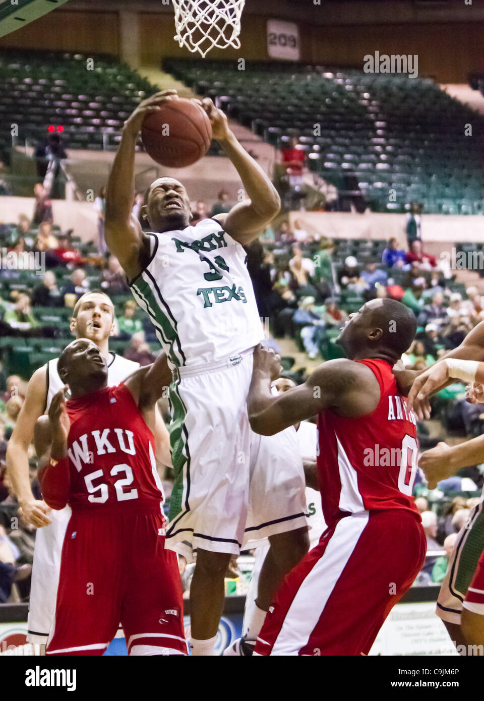 Jan. 12, 2012 - Denton, Texas, United States of America - North Texas Mean Green forward Alonzo Edwards (34) in action during the game between the Western Kentucky Hilltoppers and the University of North Texas Mean Green at the North Texas Coliseum,the Super Pit, in Denton, Texas. UNT defeated Weste Stock Photo