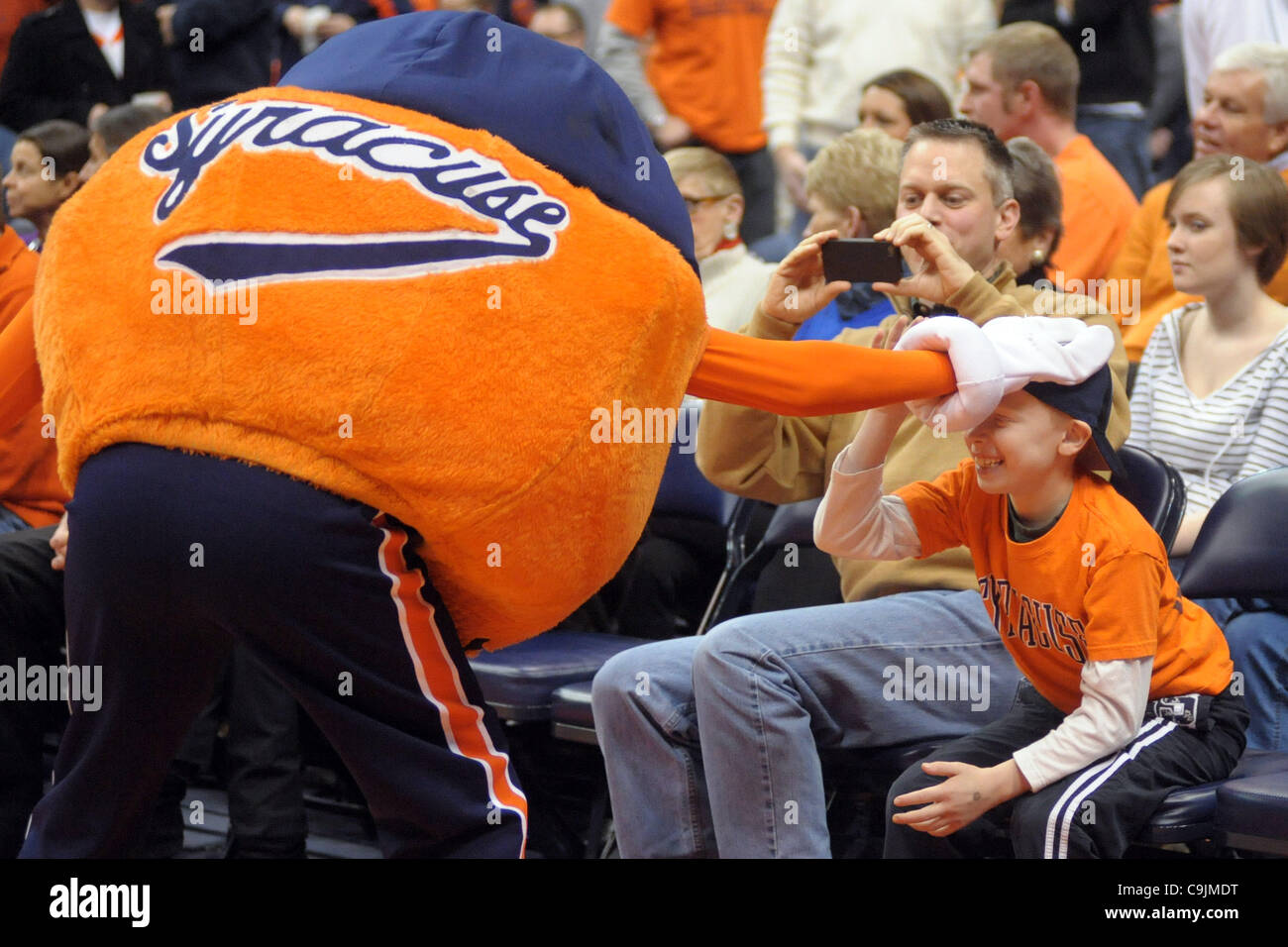 Jan. 14, 2012 - Syracuse, New York, U.S - A young fan gets harassed by Syracuse mascot Otto before the Orange battled the Providence Friars at the Carrier Dome in Syracuse, NY.  The top ranked Syracuse Orange lead the Providence Friars 38-21 at the half. (Credit Image: © Michael Johnson/Southcreek/Z Stock Photo