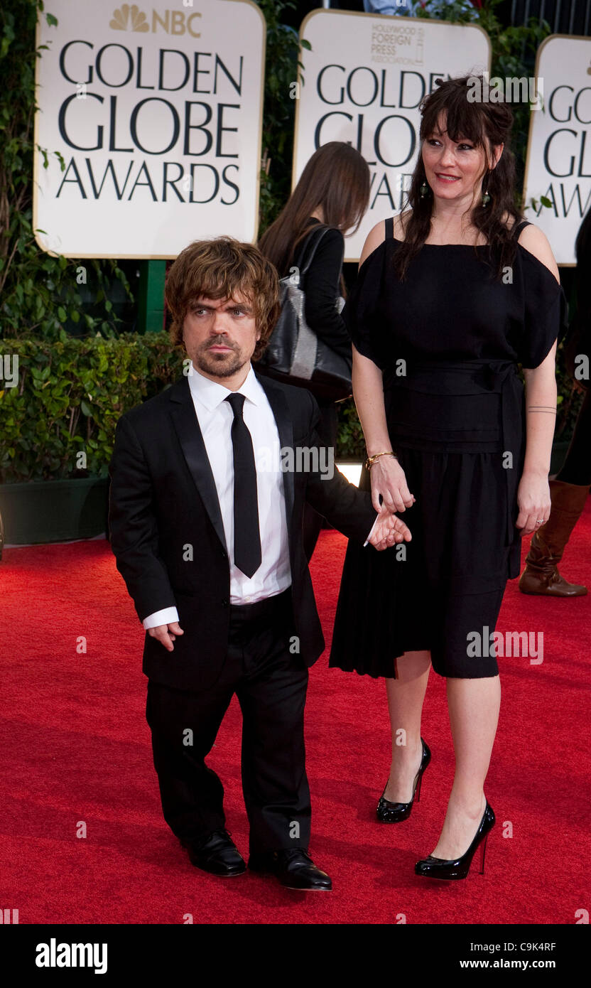 Peter Dinklage and Erica Schmidt arrive to the 69th Annual Golden Globe Awards at the Beverly Hilton Hotel in Beverly Hills, California on Sunday, January 15, 2012. Stock Photo