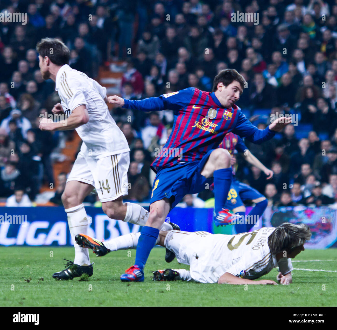 18/01/2011 - MADRID, Spain // COPA DEL REY FOOTBALL - Real Madrid vs. Barcelona - 1/4 finals - Santiago Bernabeu ------- Messi from FC Barcelona as he falls to the ground Stock Photo