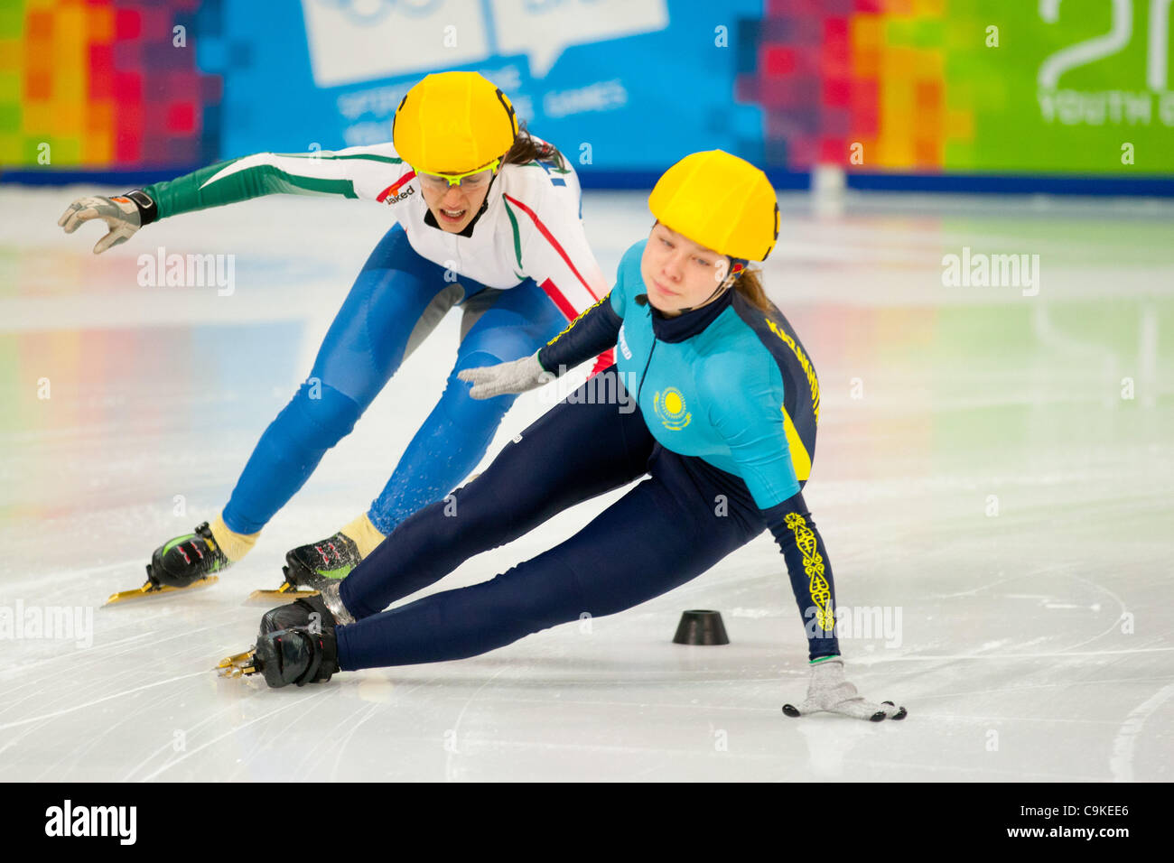 Jan. 18, 2012 - Innsbruck, Austria - Dariya Goncharov from Kazakistan falls on the ice as Nicole Martinelli from Italy chase during women's 1000m short track speed skating event at the Winter Youth Olympic Games (YOG) 2012. (Credit Image: © Marcello Farina/Southcreek/ZUMAPRESS.com) Stock Photo