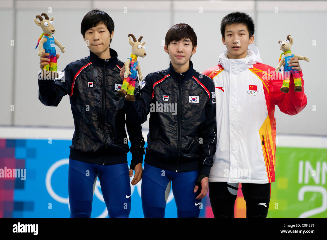 Jan. 18, 2012 - Innsbruck, Austria - from left to right Yoon Su Min and Lim Hyo Jun from Korea and  Xu Hongzhi from China during award ceremony after men's 1000m short track speed skating event at the Winter Youth Olympic Games (YOG) 2012. (Credit Image: © Marcello Farina/Southcreek/ZUMAPRESS.com) Stock Photo