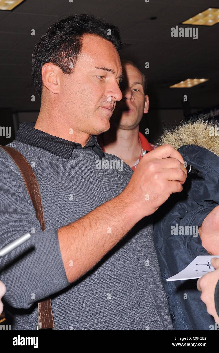 Julian McMahon, leaves the Salt Lake City International Airport out and about for Sundance Film Festival Candids - THU, , Park City, UT January 19, 2012. Photo By: Ray Tamarra/Everett Collection Stock Photo