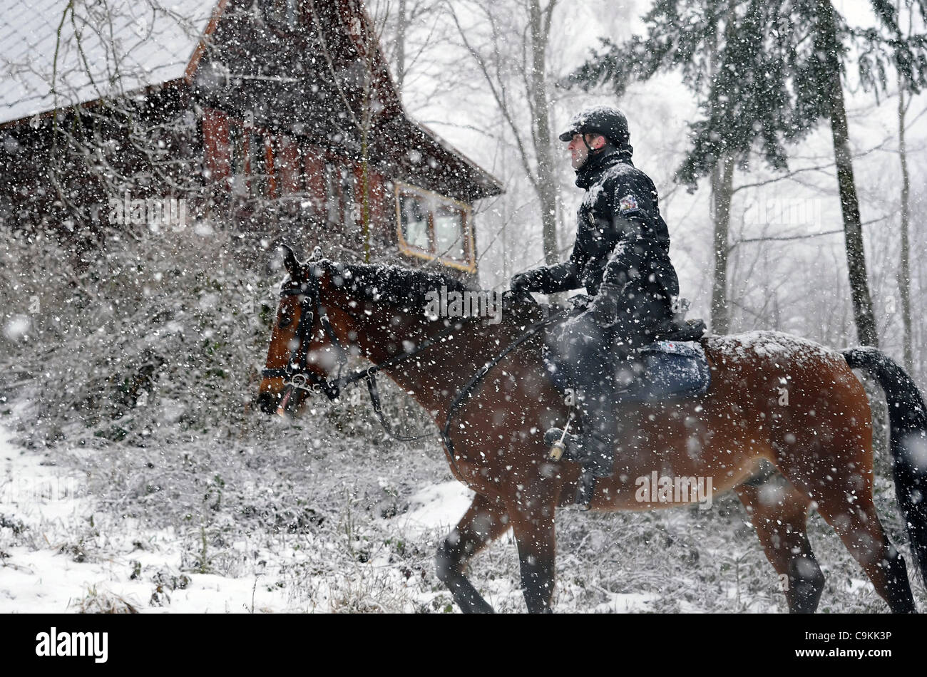 Brno Mounted Police Unit checks recreational chalets around Jedovice cottage, January 20, 2012. Last year police at Blansko recorded 40 burglaries, most thieves are stealing just in the winter months when recreational facilities are abandoned. (CTK Photo/Igor Sefr) Stock Photo
