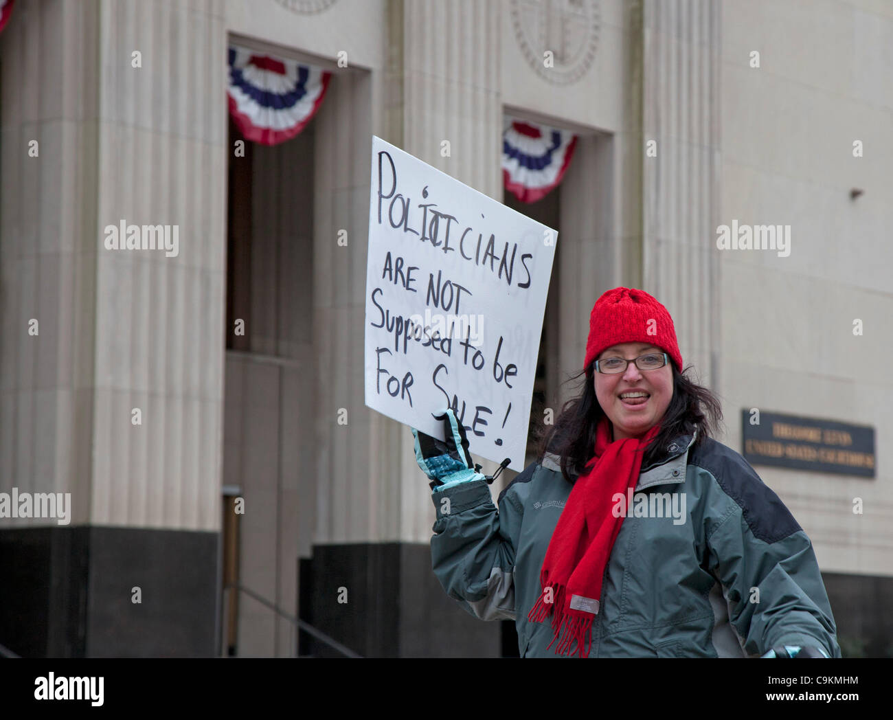 Detroit, Michigan - Activists mark the second anniversary of the Supreme Court's 'Citizens United' decision by picketing the federal courthouse. 'Citizens United' opened the way for corporations to make unlimited contributions to support or oppose political candidates. Stock Photo