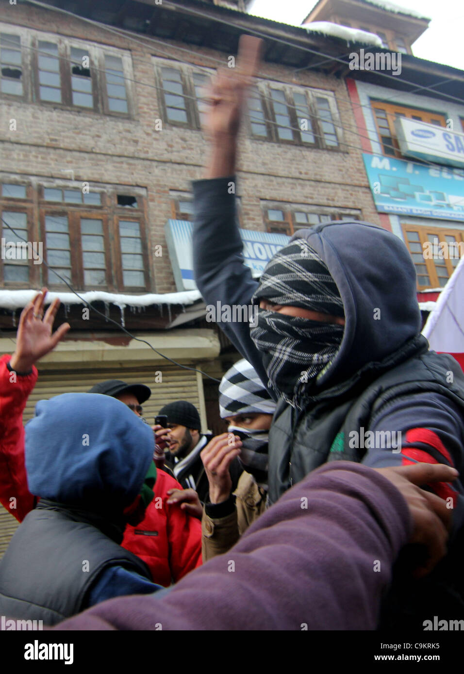 Activists and supporters of Jammu Kashmir Liberation Front (JKLF) shout freedom slogans during a protest in Srinagar,the summer capital of indian kashmir on  Jan21, 2012. The protesters were marching towards the Gaw Kadal Bridge here when the police used batons to disperse them. The protests were pa Stock Photo