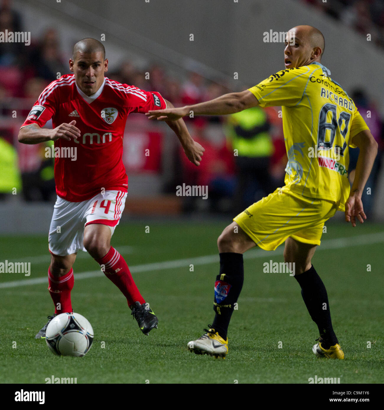 22 January 2012 - Lisbon, Portugal -   Maxi Pereira SL Benfica Defender (L) and Richard Gil Vicente FC Midfielder (R)  during the SL Benfica vs Gil Vicente FC game for the 16th round of the Portuguese Zon Sagres Football League, at Luz Stadium.  Photo Credit: Pedro Nunes Stock Photo
