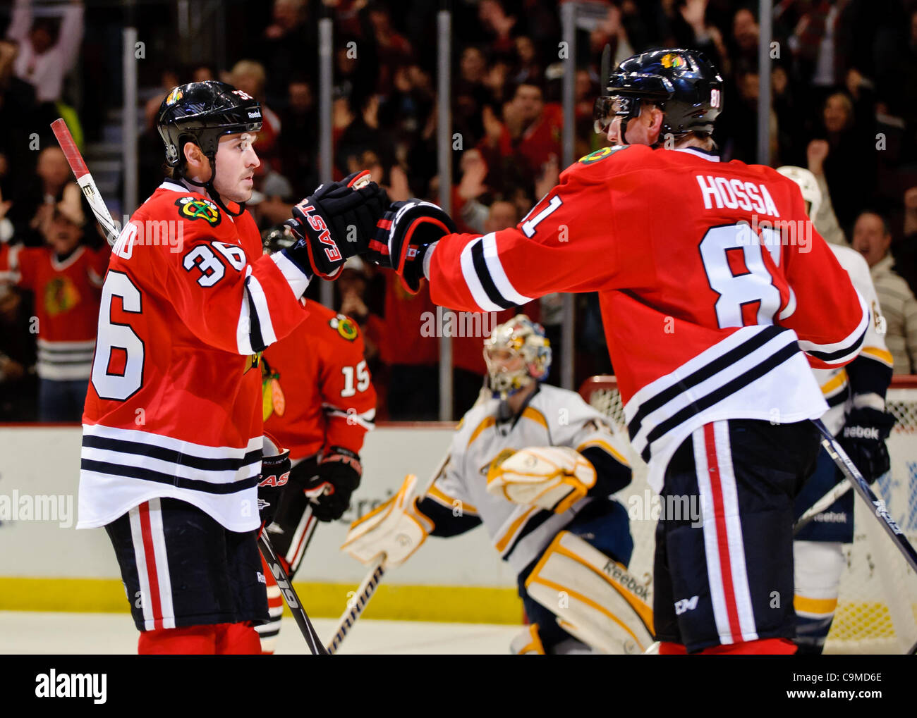 Jan. 24, 2012 - Chicago, Illinois, U.S - Chicago center Dave Bolland (36) is congratulated by right wing Marian Hossa (81) after his 3rd period goal during the NHL game between the Chicago Blackhawks and the Nashville Predators at the United Center in Chicago, IL. The Predators defeated the Blackhaw Stock Photo