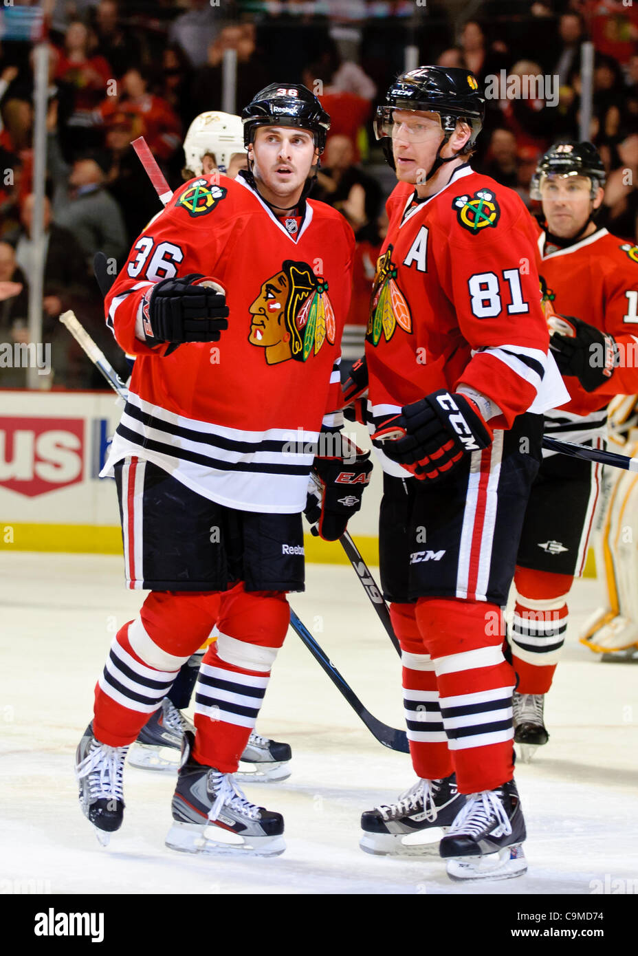 Jan. 24, 2012 - Chicago, Illinois, U.S - Chicago center Dave Bolland (36) is congratulated by right wing Marian Hossa (81) after his 3rd period goal during the NHL game between the Chicago Blackhawks and the Nashville Predators at the United Center in Chicago, IL. The Predators defeated the Blackhaw Stock Photo