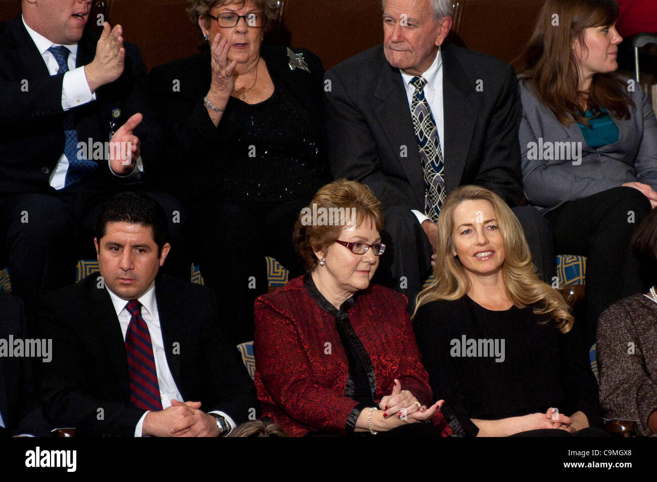 Jan. 24, 2012 - Washington, District of Columbia, U.S. - Warren Buffet's secretary, DEBBIE BOSANEK (left0 sits alongside of Steve Jobs' wife, LAURENE POWELL JOBS, as President Barack Obama delivers his third State of the Union address in the House chamber to a joint session of Congress on Tuesday ni Stock Photo