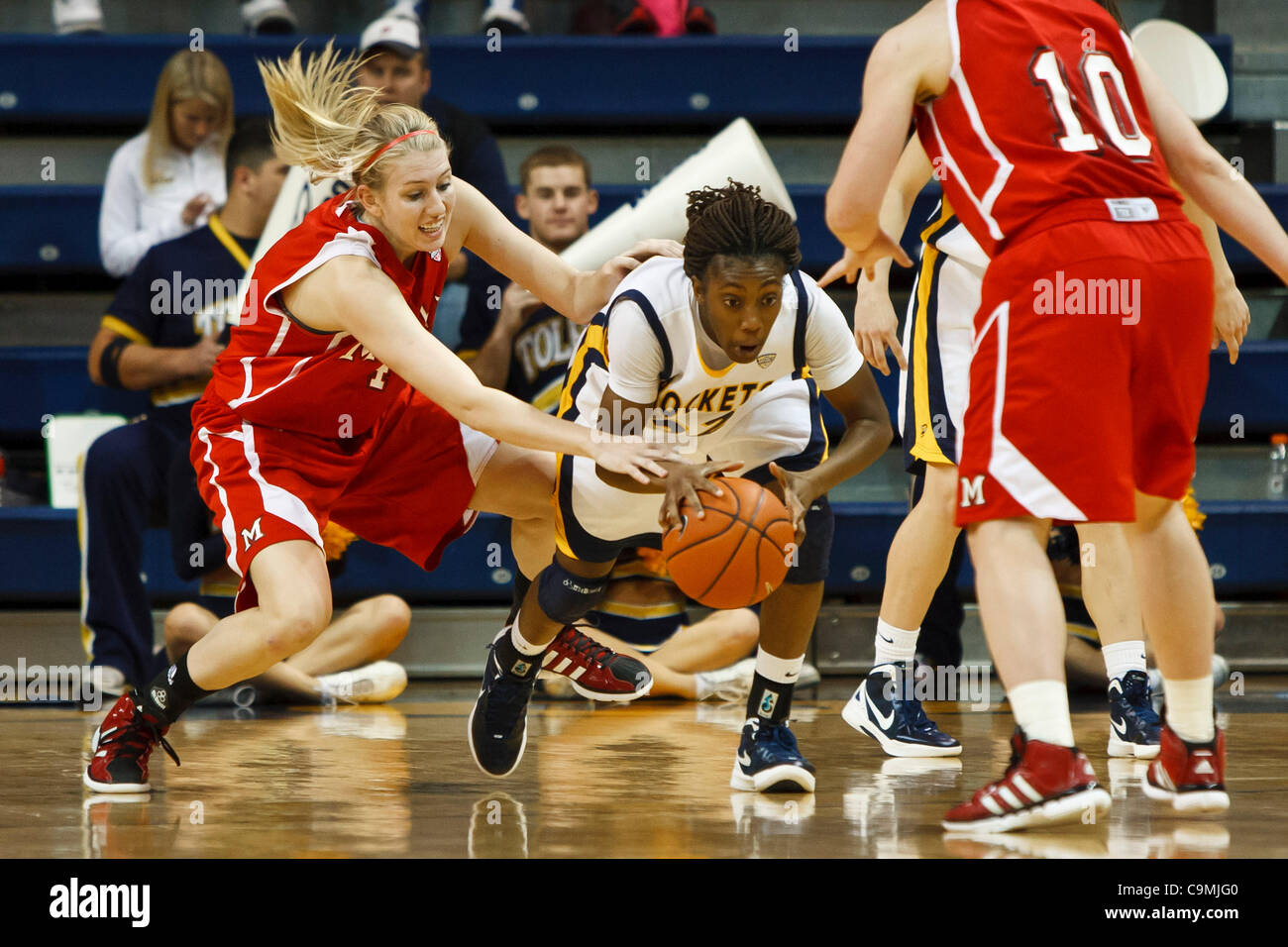 Jan. 25, 2012 - Toledo, Ohio, U.S - Toledo guard Andola Dortch (22) and Miami (OH) guard Hannah Robertson (32) battle for control of a loose ball during second-half game action. The Toledo Rockets, of the Mid-American Conference West Division, defeated the Miami RedHawks, of the MAC East Division, Stock Photo