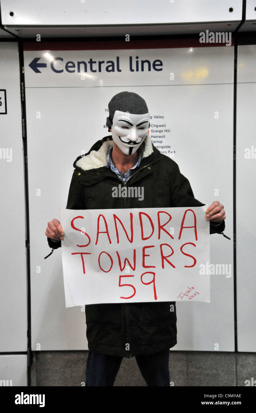 Protesters against the Welfare Reform Bill block Oxford Circus Saturday 28/1/12.  Masked protester at Holborn station as the group moves to Oxford Circus. Stock Photo