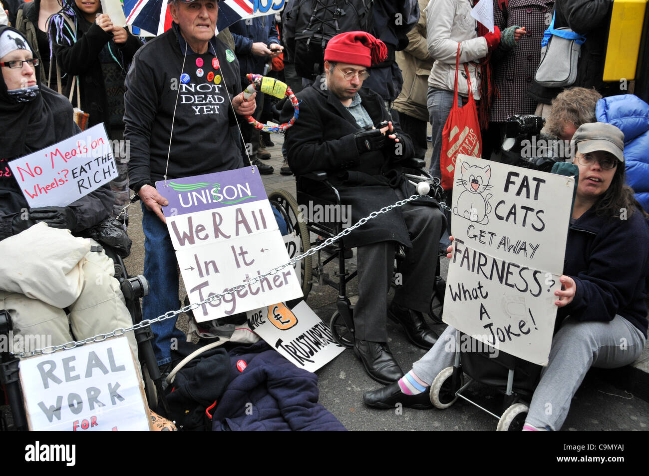 Protesters against the Welfare Reform Bill block Oxford Circus Saturday 28/1/12.  Wheelchair users are chained together across the road outside Niketown. Stock Photo