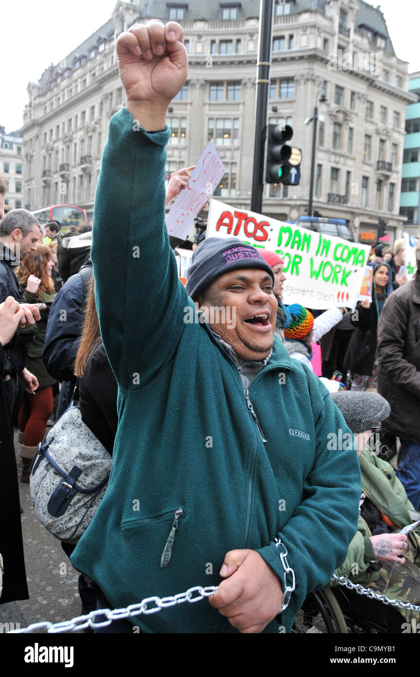 Protesters against the Welfare Reform Bill block Oxford Circus Saturday 28/1/12.  Wheelchair users are chained together across the road outside Niketown. Stock Photo