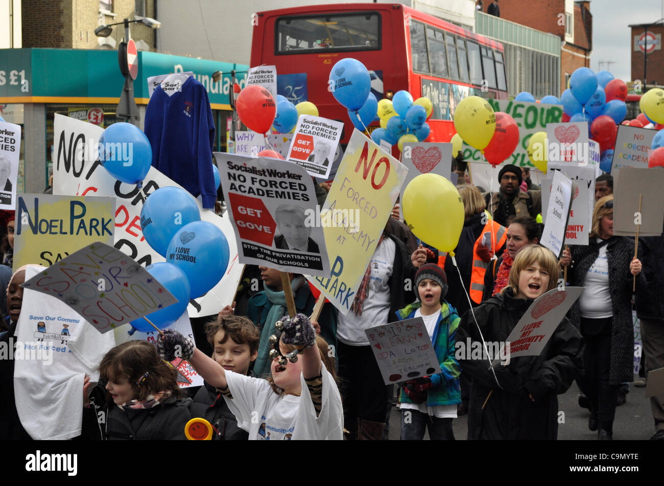 28/01/2012 Haringey, London UK. Enthusiastic young students lead parents and teachers in a protest against plans to turn Downhills primary school Tottenham into a sponsored academy. Stock Photo