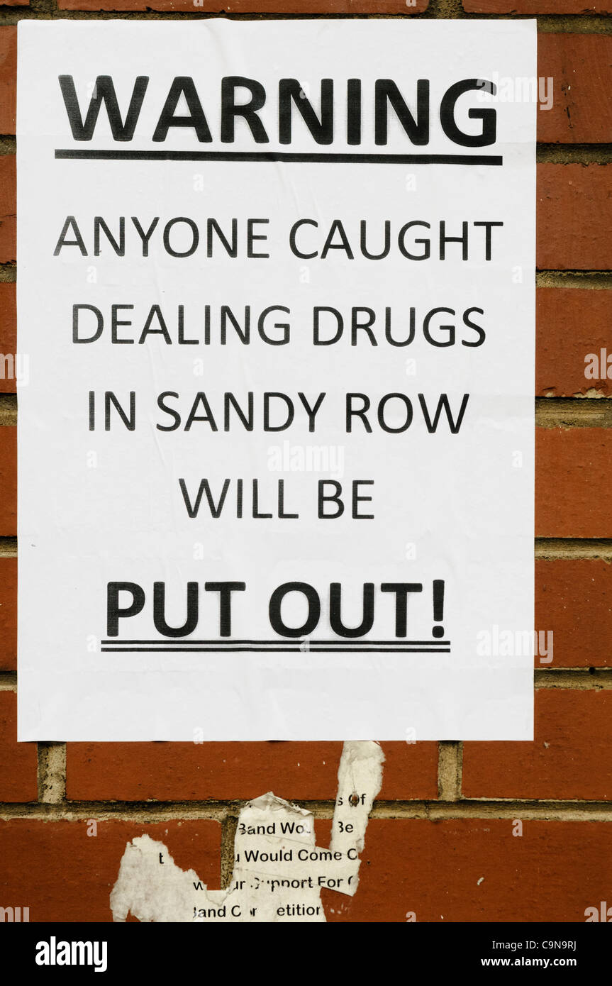 Posters appear overnight in Sandy Row warning drug dealers that they will be 'Put Out' of the area, and based on past events, will likely be 'kneecapped' (shot through both knees).  It is thought the Ulster Defence Association is behind the move. BELFAST. 30/01/2012 Stock Photo