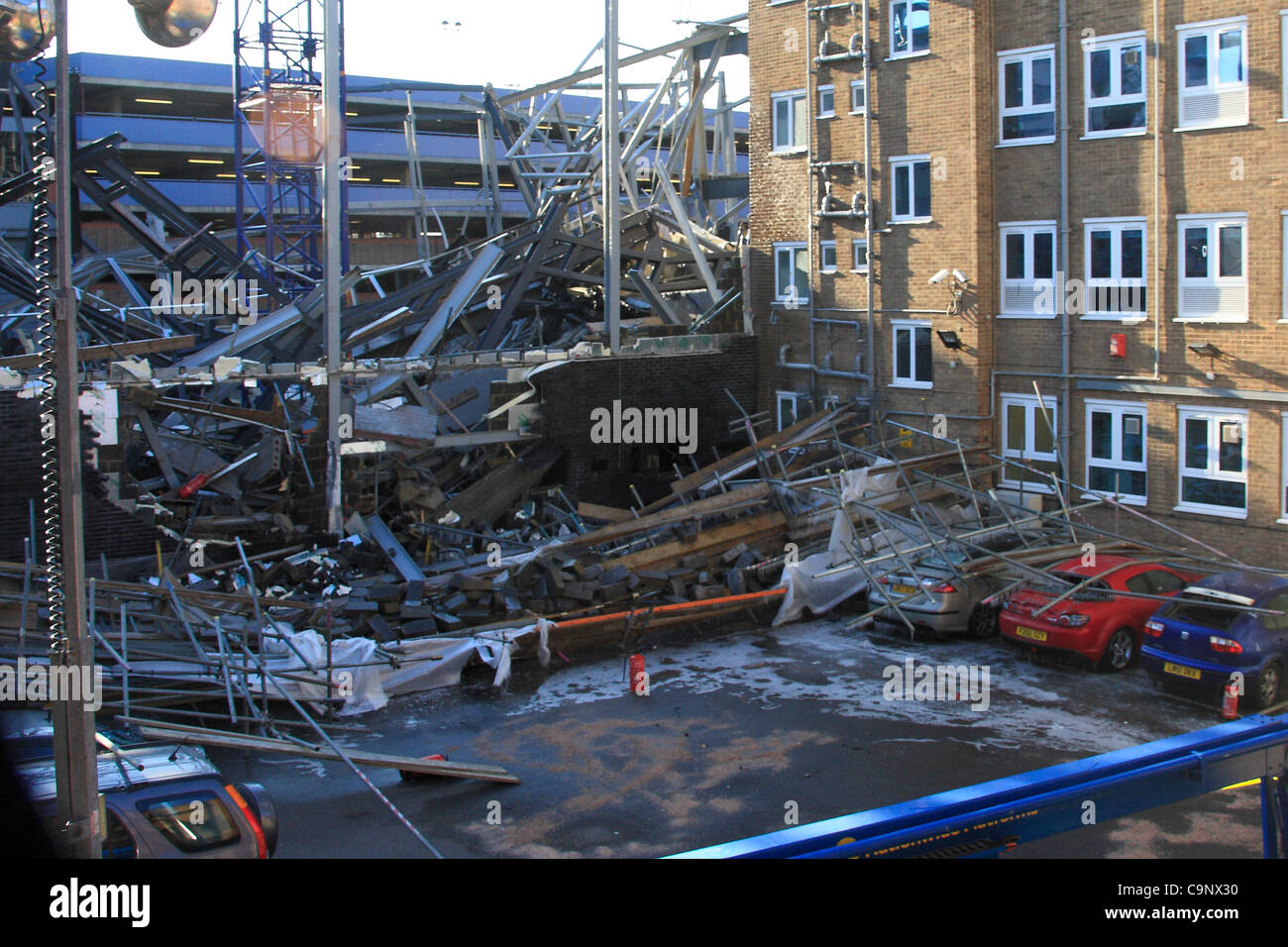 Crushed cars and debris in the staff car park of Redbridge Council
