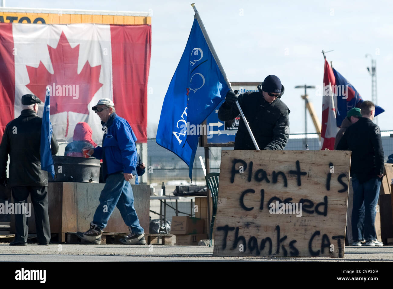 London Ontario, Canada - February 4, 2012. One day after learning they jobs were gone and factory that had been open for more than 60 years was to be closed, workers at the Electro Motive plant continued their picket. The Canadian Auto Workers Union has said the workers will stay on the line until t Stock Photo