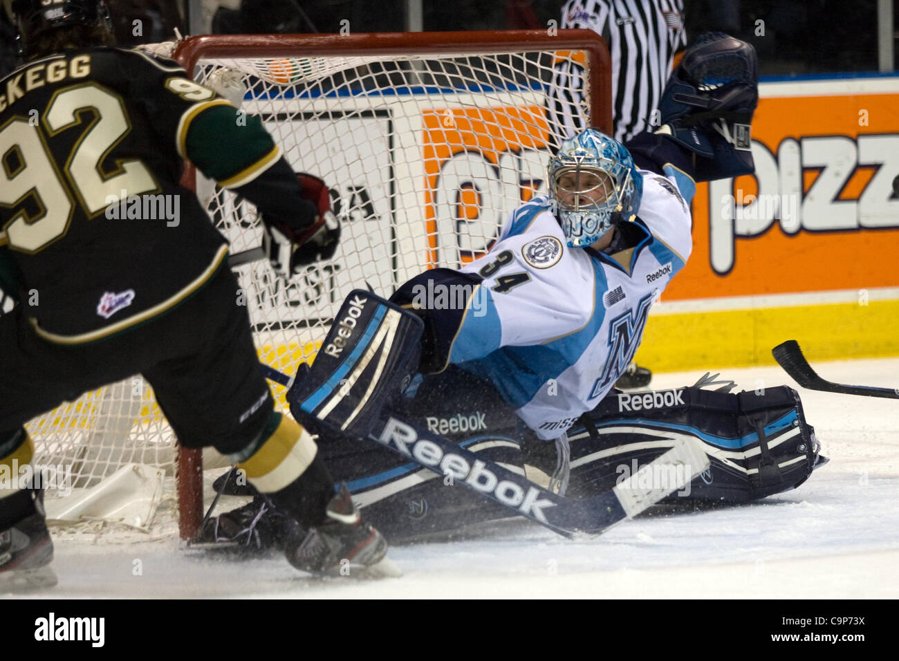 London Ontario, Canada - February 4, 2012. Majors goalie Brandon Maxwell makes a save on Brett McKegg of the Knights in a Ontario Hockey League game between the London Knights and the Mississauga St. Michaels Majors. London won the game 5-2. Stock Photo