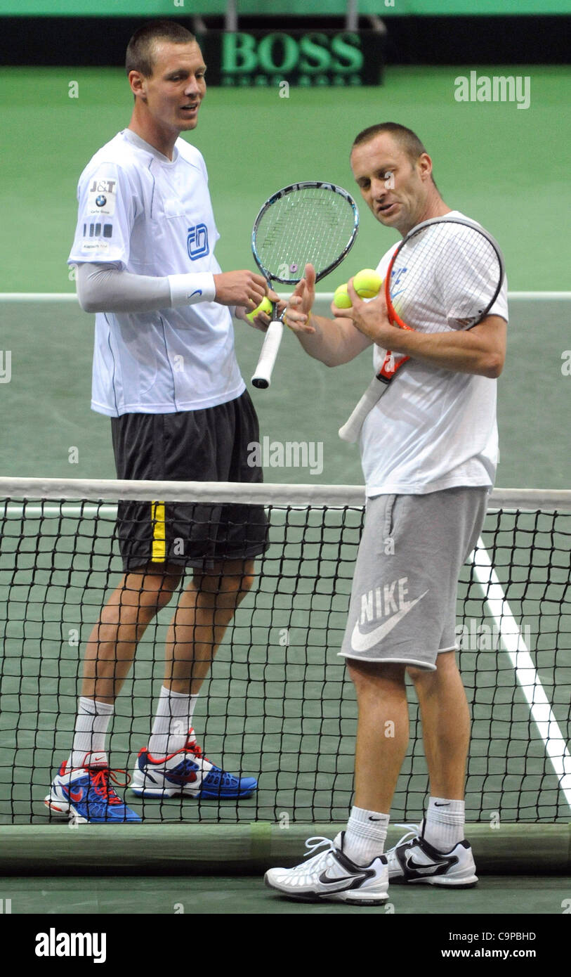 Czech tennis player Tomas Berdych (left) trains with his coach Tomas Krupa  prior to Davis Cup tennis match Czech Republic vs. Italy in Ostrava, Czech  Republic, on Tuesday, February 7, 2012. (CTK