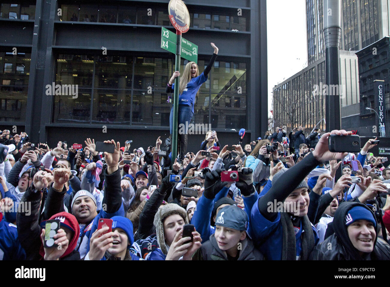 Feb. 7, 2012 - New York, New York, U.S - During the Superbowl Champion Parade fans cheer their winning team the New York Giants riding up Broadway Ave. in Lower Manhattan. (Credit Image: © Gary Dwight Miller/ZUMAPRESS.com) Stock Photo