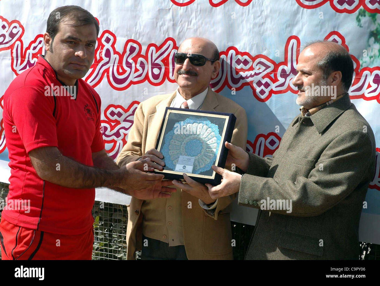 Balochistan Sports Minister, Mir Shahnawaz Khan Murree along with Iran Consul Gen, Syed Hassan Yehyavi awards prizes among football players during prize distribution ceremony of a football tournament arranged by Khana-e-Farhang Iran held in  Quetta on Friday, February 10, 2012 Stock Photo