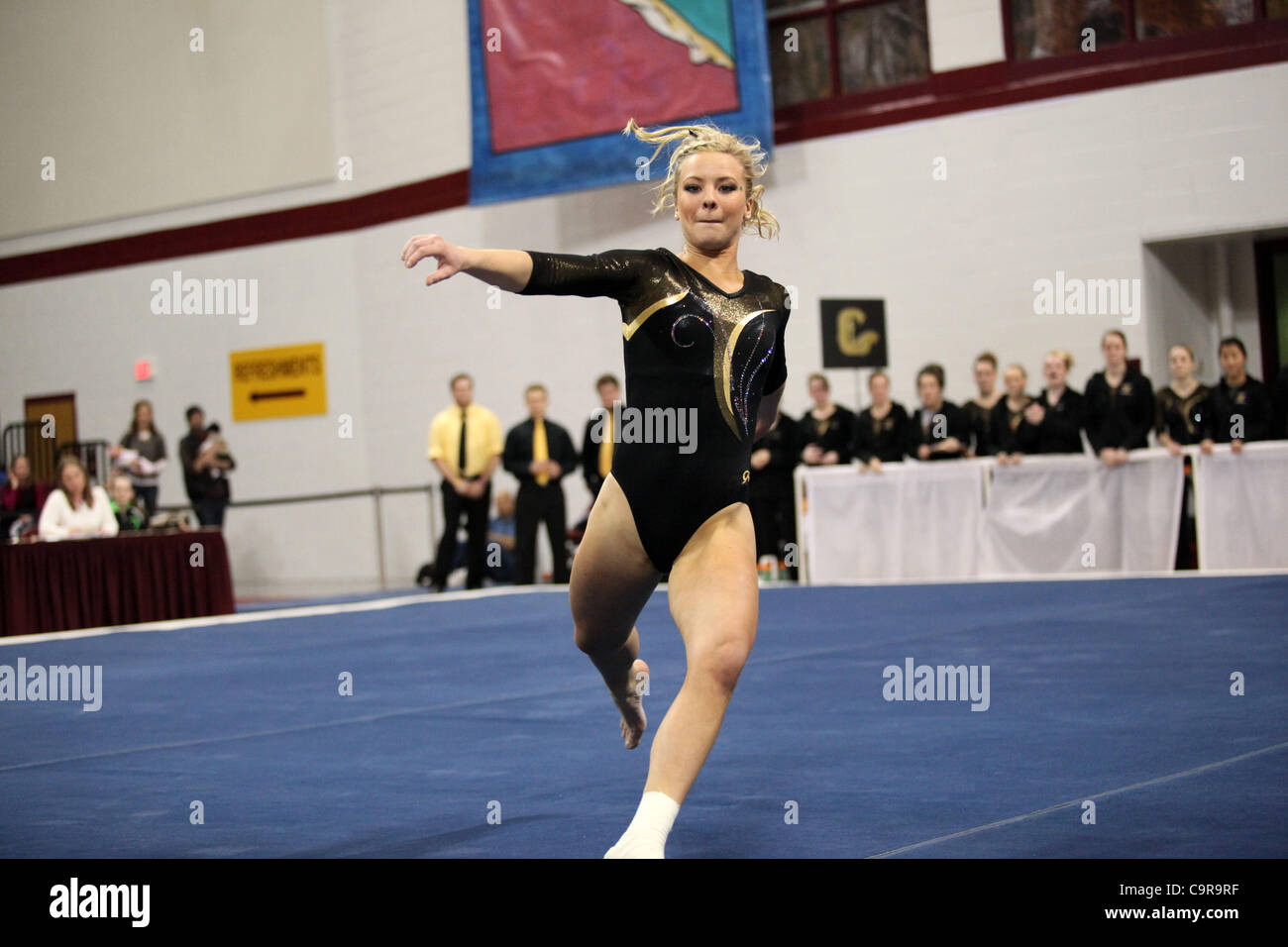 Sam Opsahl of Gustavus Adolphus College competes in the floor exercise