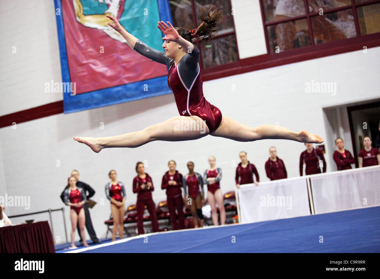 Summer Haag of Hamline University leaps through the floor exercise during during the Best of Minnesota gymnastics competition at the University of Minnesota, Minneapolis, Minnesota, Feb. 11, 2012. Stock Photo