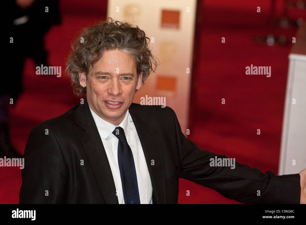 London, UK, 12/02/2012. Actor Dexter Fletcher, arrives on the red carpet, to attend the 2012 BAFTAs Stock Photo