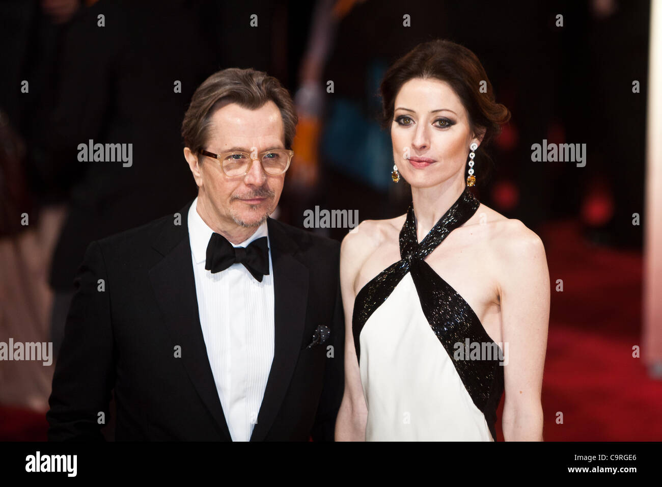 London, UK, 12/02/2012. Actor, Gary Oldman with his wife Alexandra Edenborough, arriving on the red carpet for the 2012 BAFTAs Stock Photo
