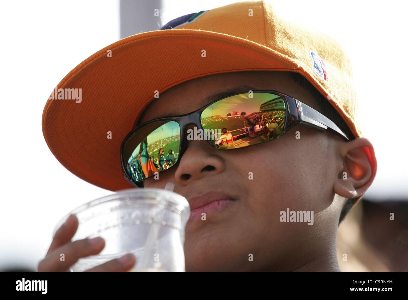 Young rugby fan wearing reflective glasses at a public appearance for
