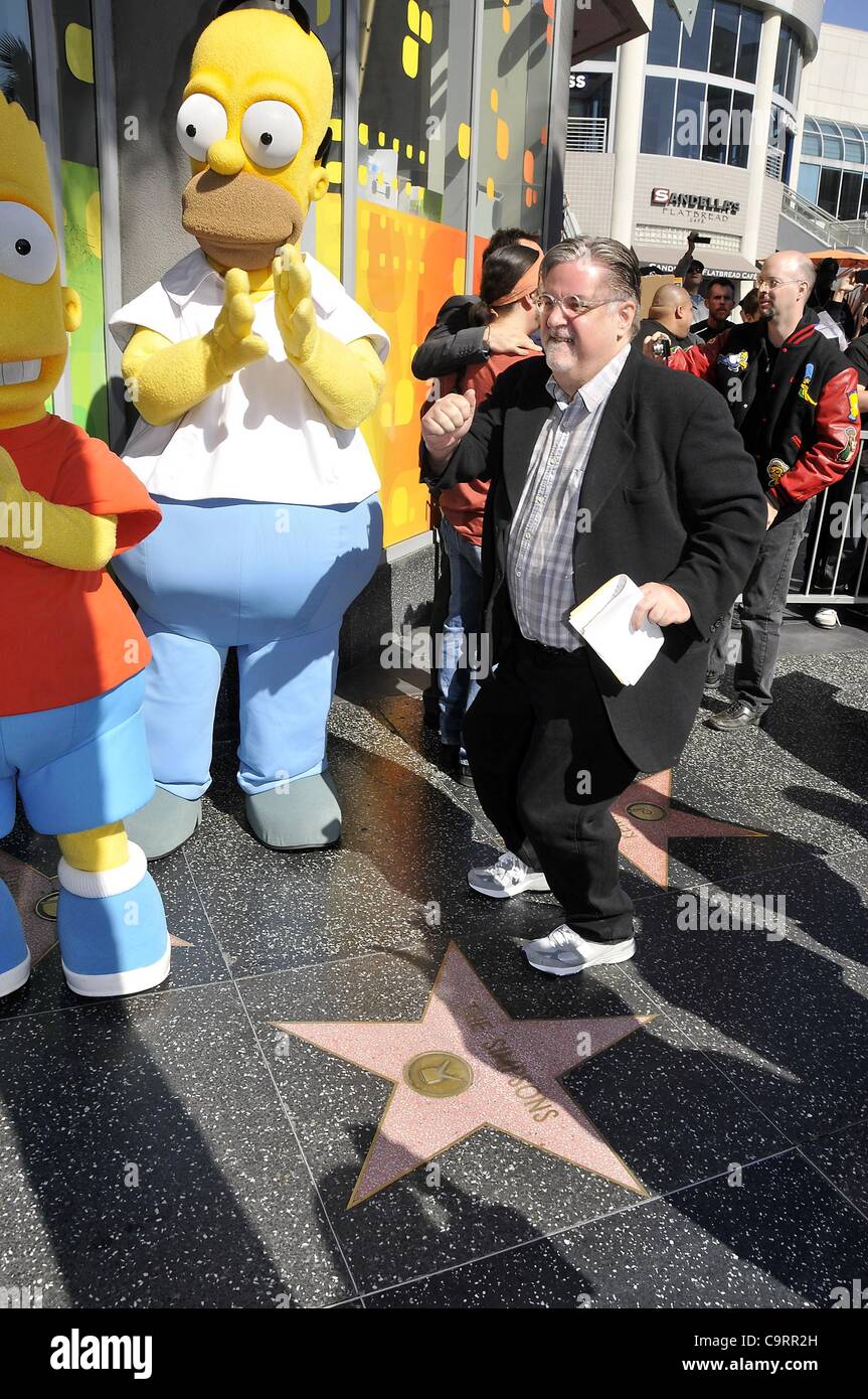 Bart Simpson character, Homer Simpson character, Matt Groening at the induction ceremony for Star on the Hollywood Walk of Fame for Matt Groening, Hollywood Boulevard, Los Angeles, CA February 14, 2012. Photo By: Michael Germana/Everett Collection Stock Photo
