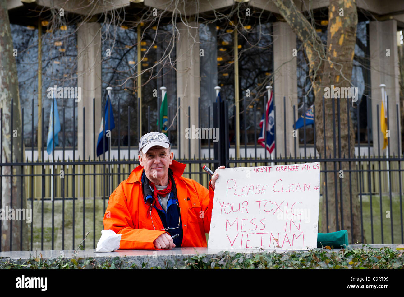 A man concerned about the long term effects of Agent Orange, used in the Vietnam war, joins the Save Shaker campaign protest outside the US Embassy, Grosvenor Square, London.  14 February 2012 Stock Photo