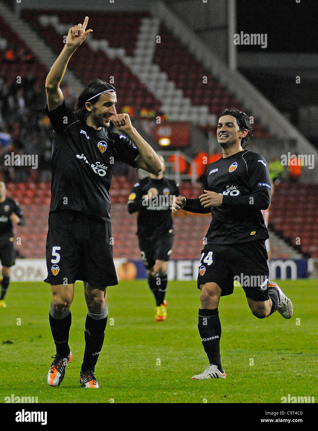 Valencia No.5 Mehmet Topal celebrates his goal with No.24 Alberto ...