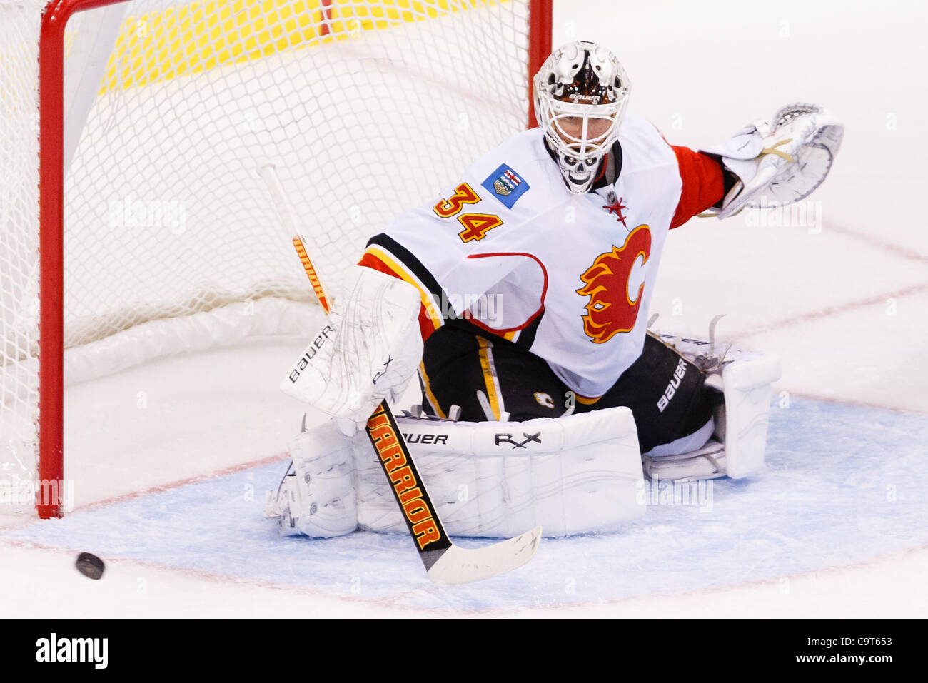Calgary Flames goaltender Miikka Kiprusoff looks up at the replay following  a goal by Tampa Bay Lightning Brad Richards during first period of game  four of the NHL Stanley Cup Finals Monday