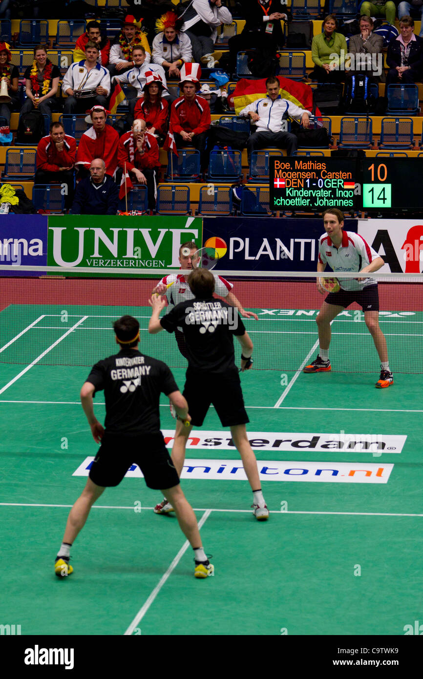 AMSTERDAM, THE NETHERLANDS; 19/02/2012. Badminton players Carsten Mogensen and Mathias Boe (Denmark, top) win their match against Ingo Kindervater and Johannes Schoettler (Germany, bottom) in the finals of the European Team Championships Badminton 2012 in Amsterdam. Stock Photo