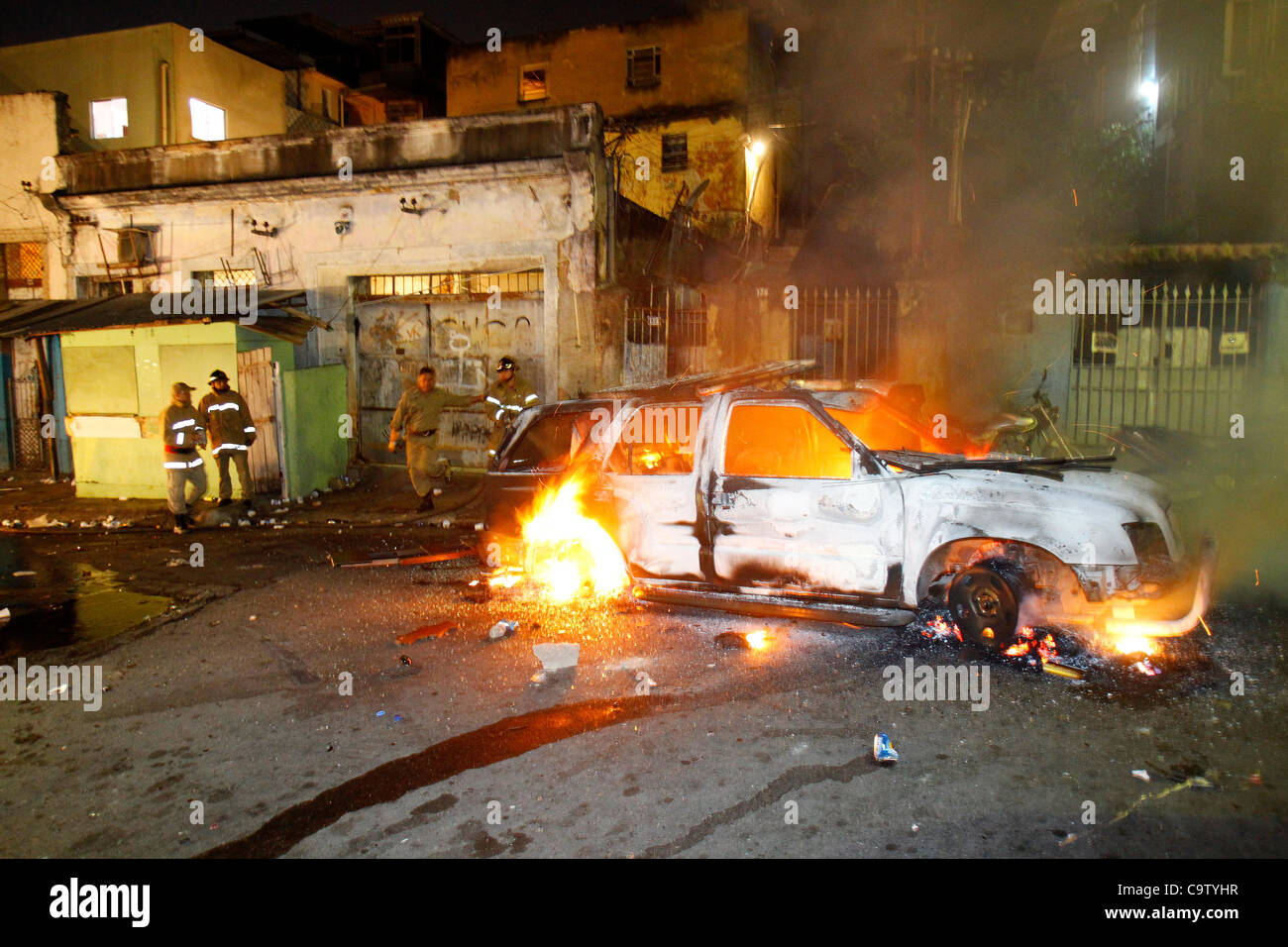 Rio de Janeiro, 20th february 2012 - Police arrested chief of drug dealers in São Carlos favela, in retaliation the community put fire on a police car. Intense crossfire between police and bandits occur and one student 14 years old was shot dead on the spot, two other people get wounded. Stock Photo