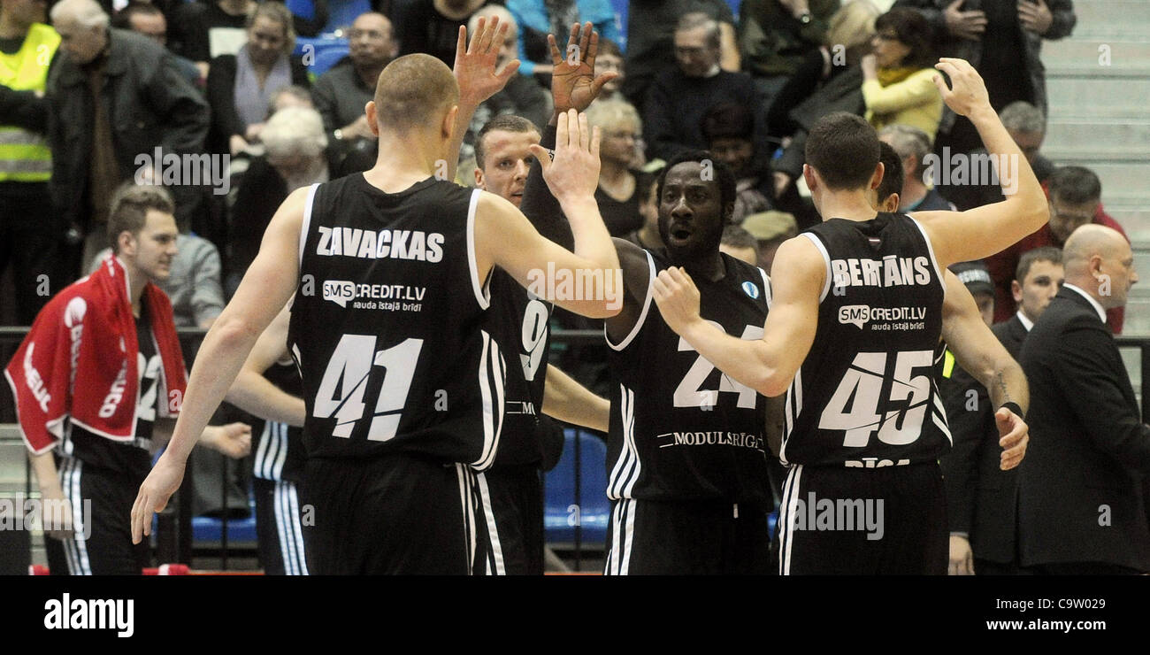 Riga players celebrate their victory in the Eurocup basketball match ...