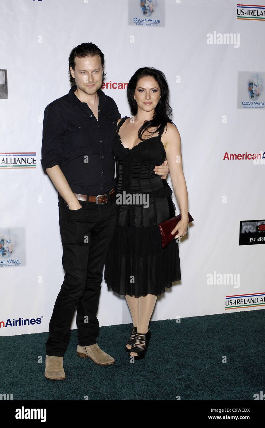 Colin Devlin, Sonya Macari at arrivals for Oscar Wilde: Honoring The Irish in Film, Bad Robot, Los Angeles, CA February 23, 2012. Photo By: Michael Germana/Everett Collection Stock Photo