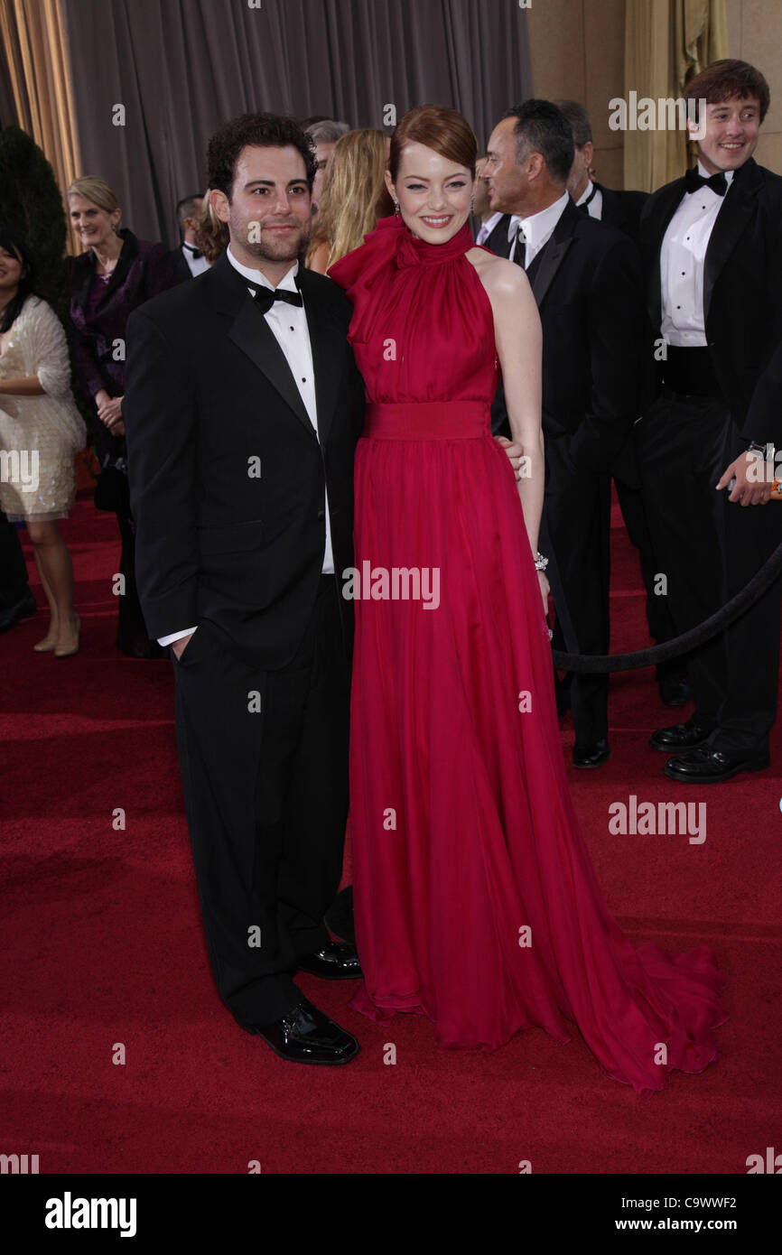 Feb. 26, 2012 - Hollywood, California, U.S. - EMMA STONE wears a red  Giambattista Valli gown and Louis Vuitton jewels as she arrives on the  Oscar red carpet at the 84th Academy